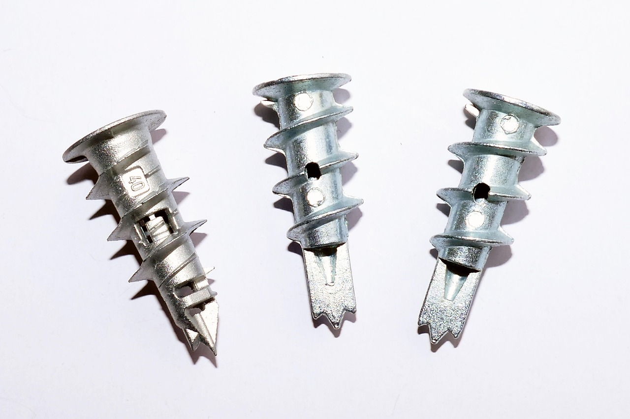 Construction materials including raw plugs, screws, and wall anchors used in professional home renovation